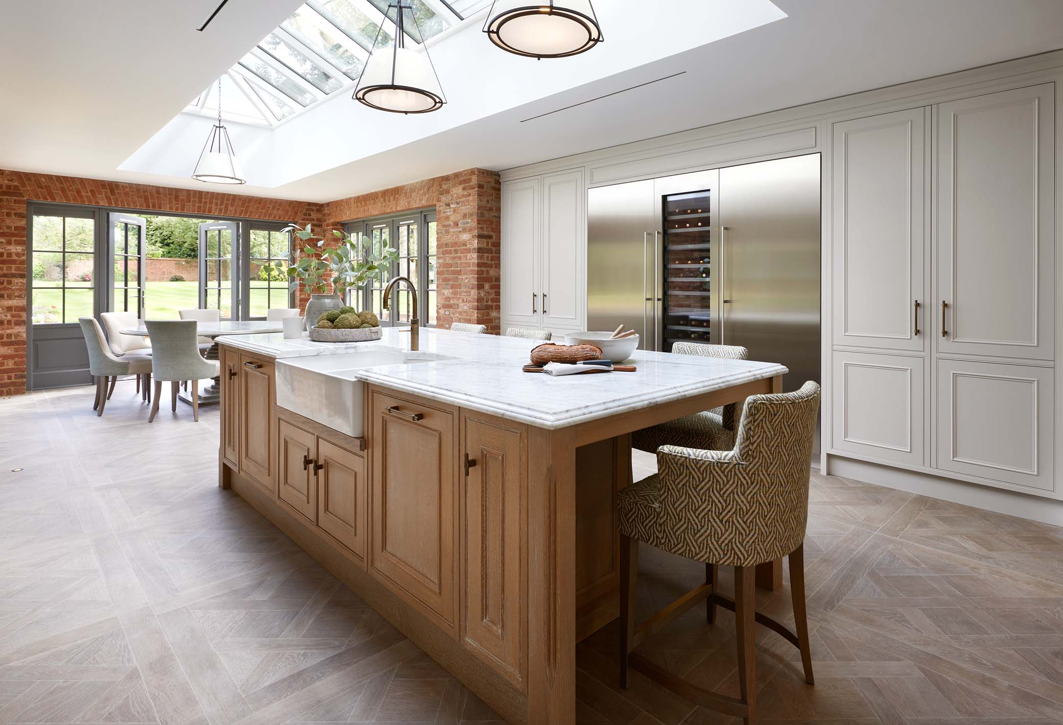 bespoke kitchen island with cabinetry and wine fridge