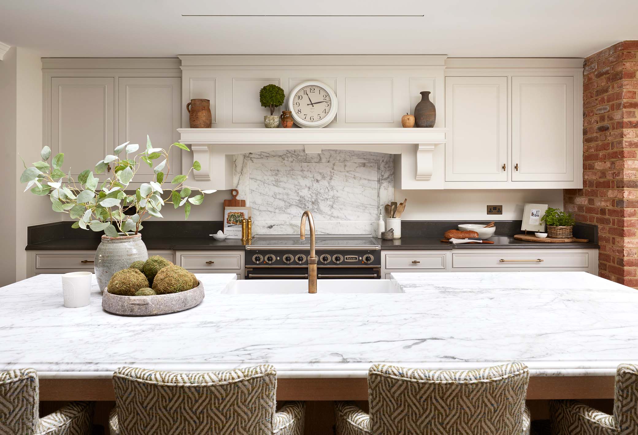 luxury kitchen worksurface in a surrey kitchen with range cooker and cabinets in the background