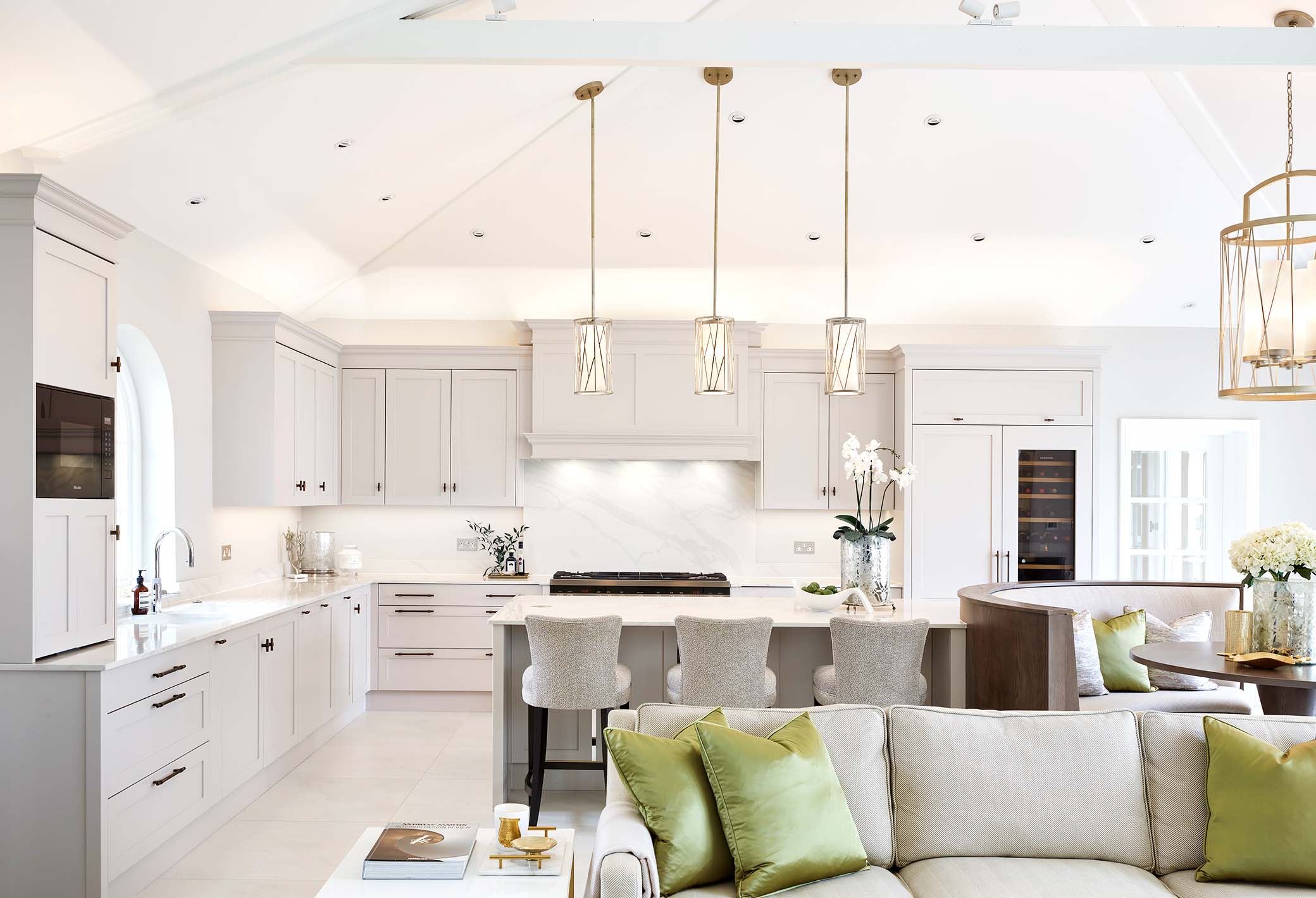 bright lyon layon bespoke kitchen with high ceiling and sofa in the foreground